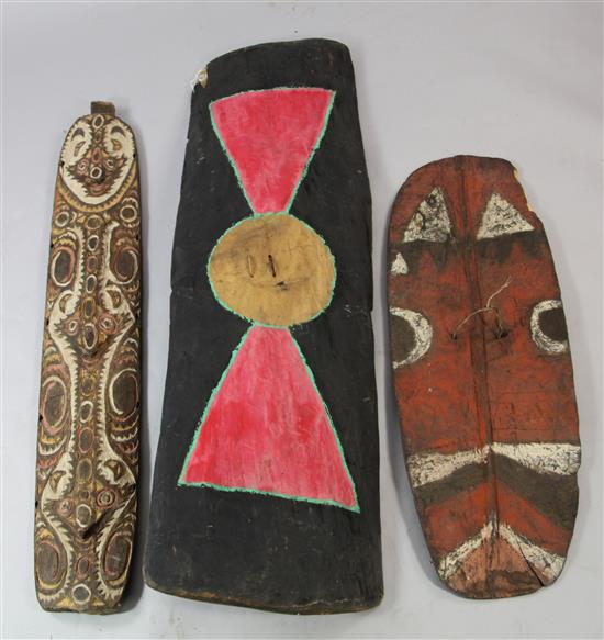 Three Sepik River carved and painted tribal shields